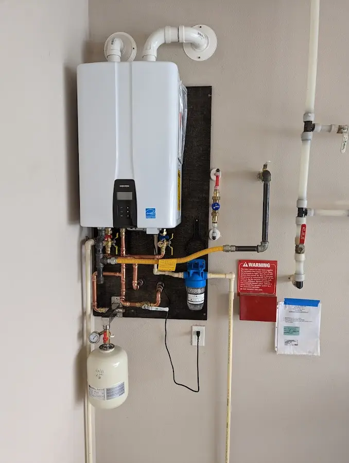 Professional plumber installing copper piping in a East Hanover home